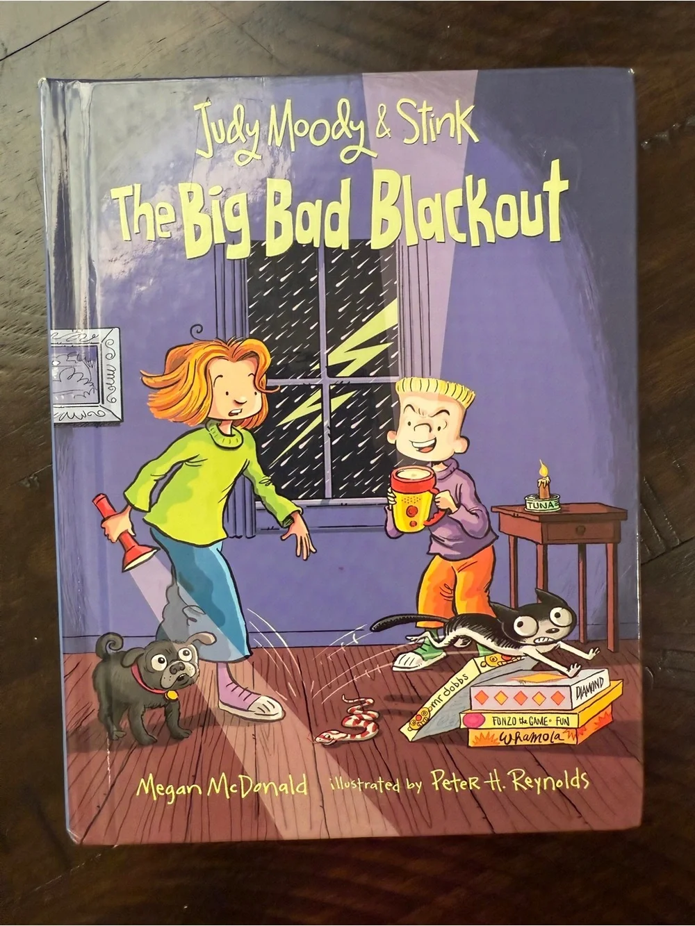 Scholastic Purple Children’s Book Back Cover with Red Umbrella Illustration